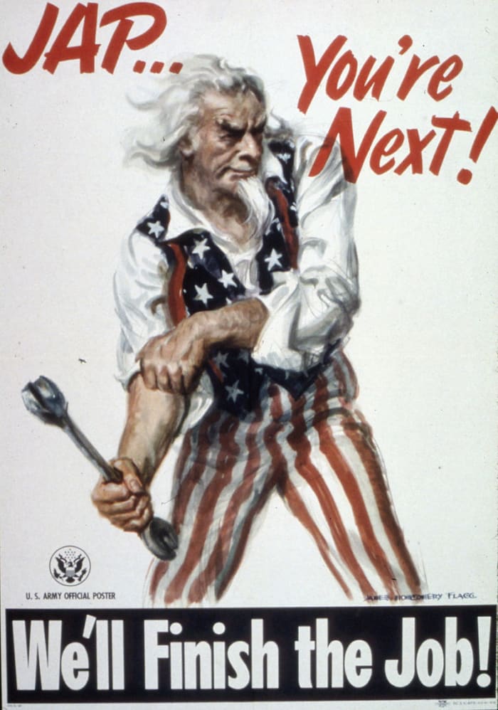 Uncle Sam rolling up his sleeves getting ready to defeat Japan after the surrender of Germany.