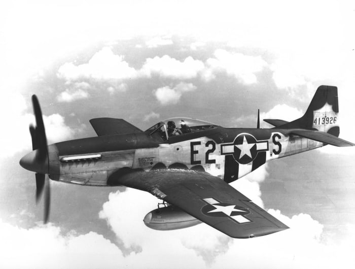 The P-51 with its drop tanks which could be jettisoned in an emergency. P-51 could fly over 600 miles from its British bases with drop tanks.
