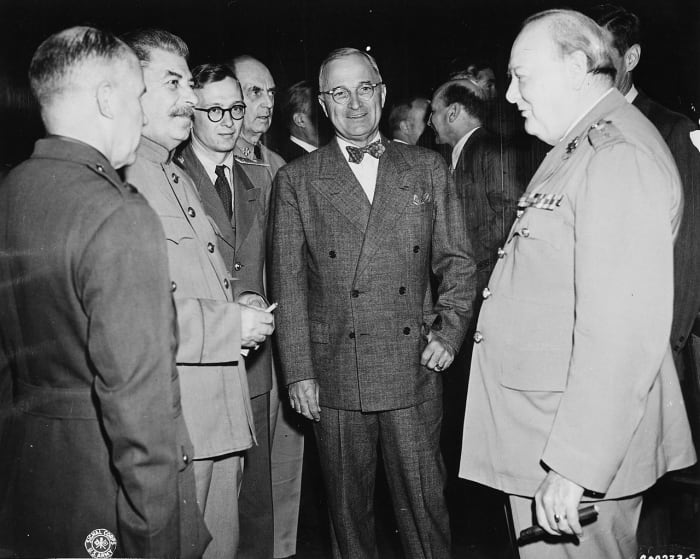 Harry S. Truman center of picture at Potsdam July 1945 with Stalin and Churchill. Truman would give the green light for the Atomic Bomb attack on Hiroshima and Nagasaki.