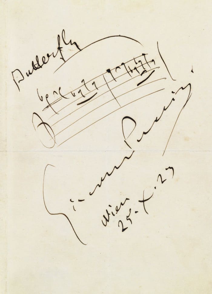 Notation of the opening of the aria 'One Fine Day' with Puccini's signature.