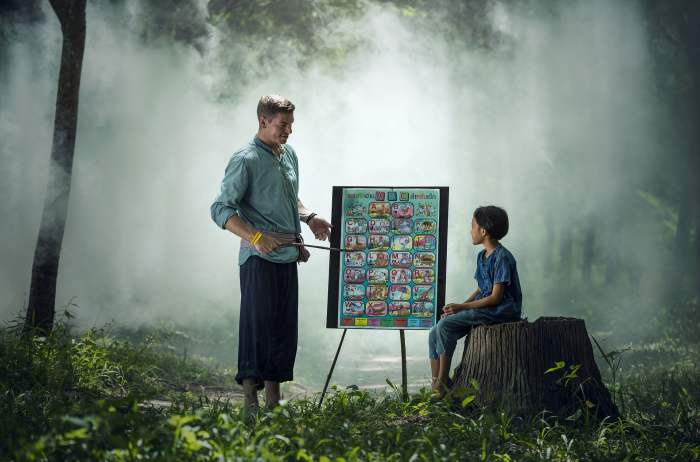 I don't know why this teacher is teaching his student outside in a foggy forest. District budget cuts, perhaps?