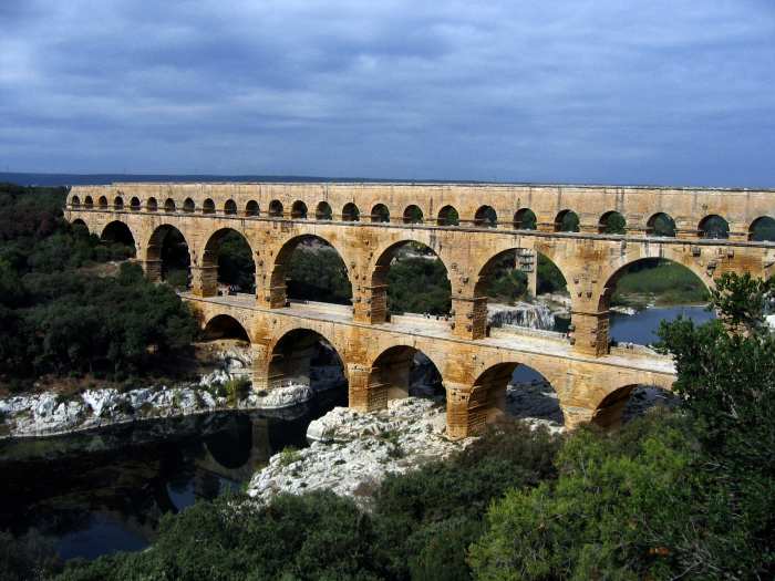 The multiple arches of the Pont du Gard in Roman Gaul (modern-day southern France). The upper tier encloses an aqueduct that carried water to Nimes in Roman times; its lower tier was expanded in the 1740s to carry a wide road across the river.