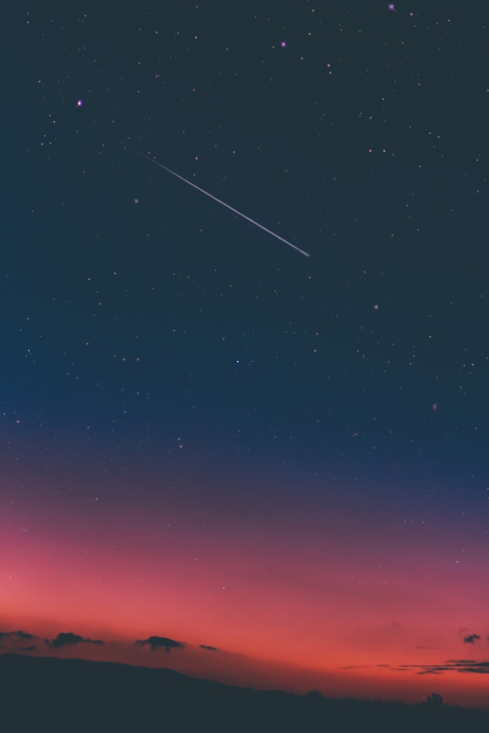 A photograph of a "shooting star". Shooting stars are actually particles of space debris, ice and rock, burning up as they enter the earth's atmosphere