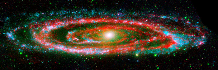 The many "personalities" of our great galactic neighbor, the Andromeda galaxy, are exposed in this new composite image from NASA's Galaxy Evolution Explorer and the Spitzer Space Telescope.