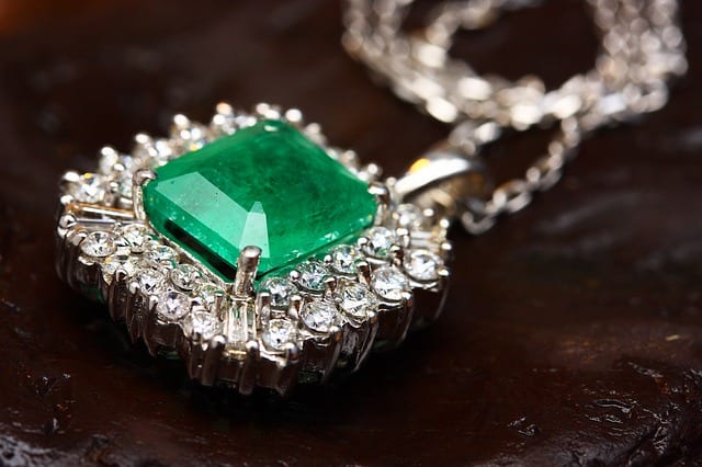 This necklace has a beautifully formed emerald at its center
