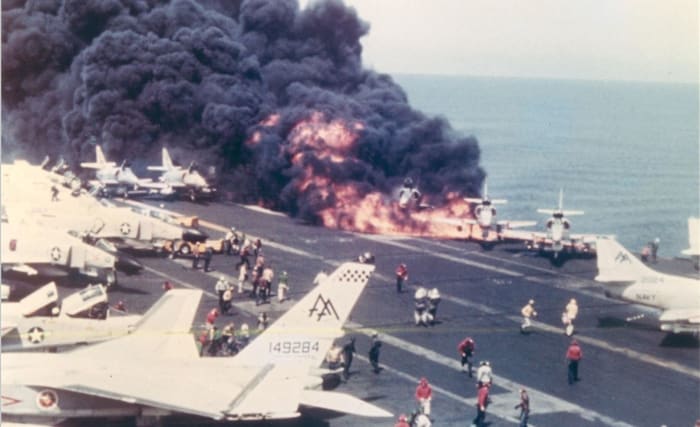 July 29, 1967 - A4s already on fire on the deck of the Forrestal, moments before the devastating explosion. McCain's A4 is third from the right, nearly engulfed.
