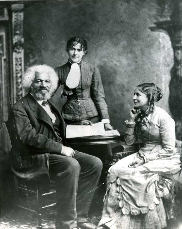 Helen Pitts Douglass (1838 – 1903), seated, with her husband Frederick Douglass. The standing woman is her sister, Eva Pitts.
