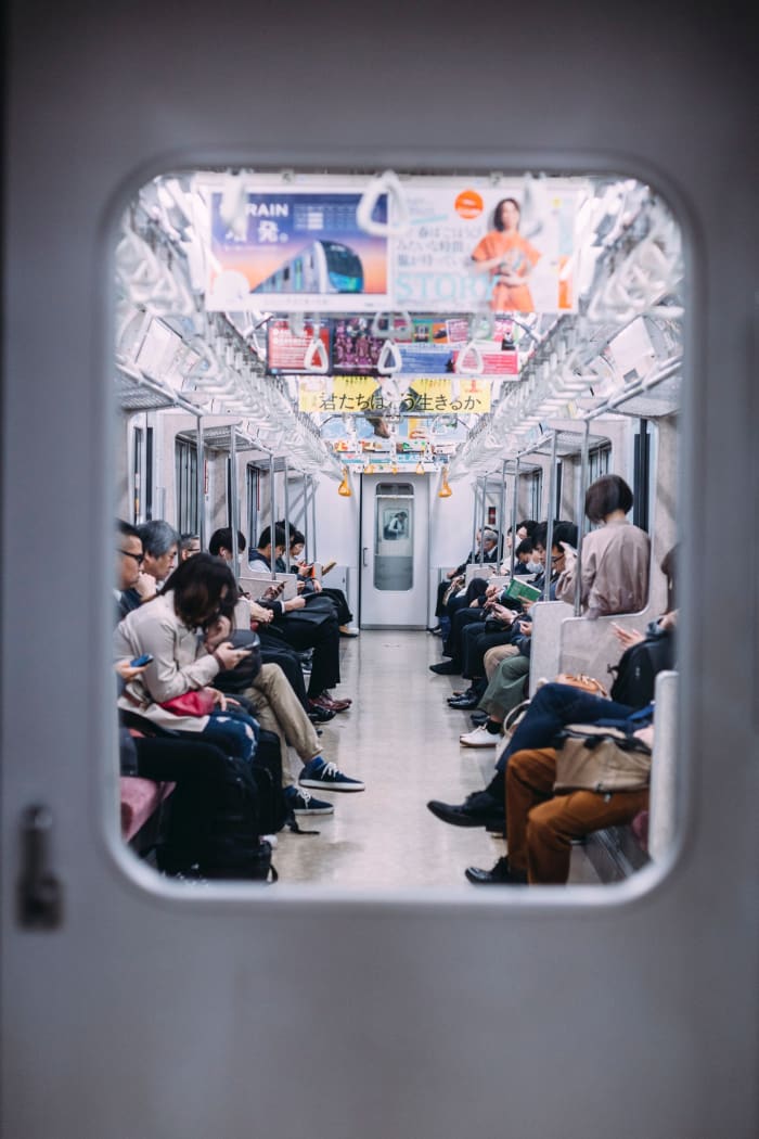 Japan's lonely subway ride. Some people might say this snapshot looks like that of any other subway in the world. The reality is that this exact scene repeats itself millions of times daily. No one talks; not a stare; total respect of others' space.
