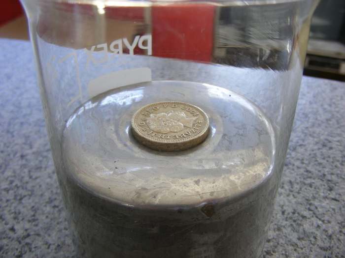 A coin floats in mercury because mercury has a density higher than the density of the metal that the coin is made from.