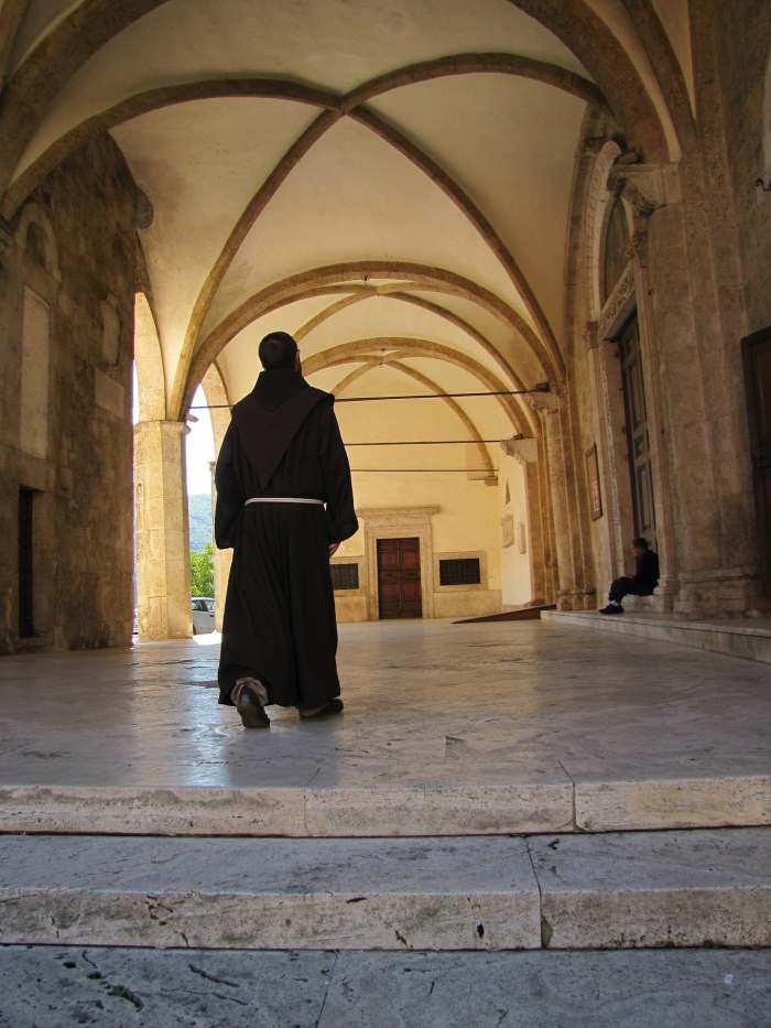 "L’abito non fa il monaco" translates to "the dress does not make the monk" and roughly equates to "clothes don’t make the man."