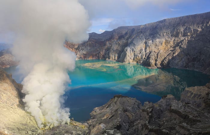 Small volcanic clouds of sulfur gas at the surface can create highly acidic lakes, like the shown here at the Kawah-Ijen volcano in Indonesia..