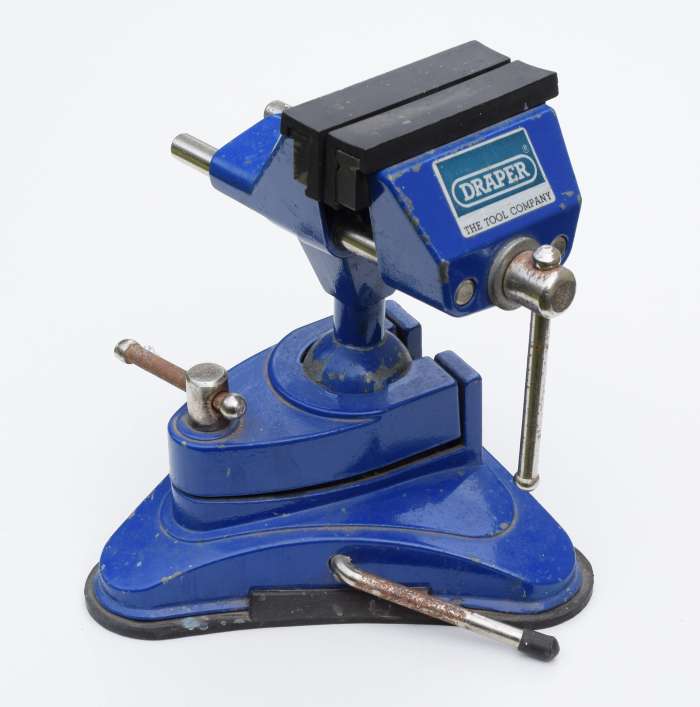 A small vice like this one is useful for holding components such as connectors when soldering. This vice has a suction base to hold it securely onto a smooth surface like a countertop.