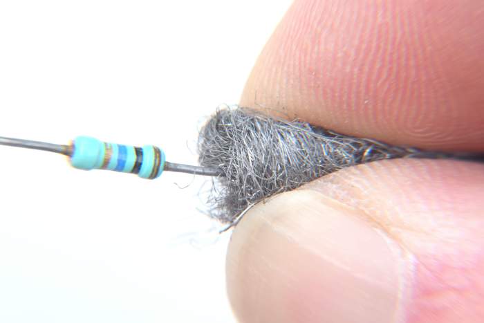 Usually leads are coated with tin, but older component leads or bare copper wire may be tarnished. Cleaning with wire wool improves solderability and gives a more reliable connection.