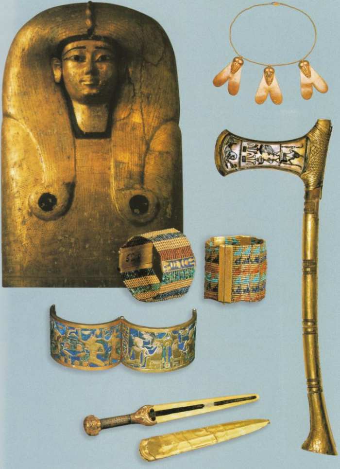 Figure 4: Coffin lid of Queen Ahhotep I along with weapons and small trinkets recovered from the Queen's grave in the Dra Abu el-Naga tomb.