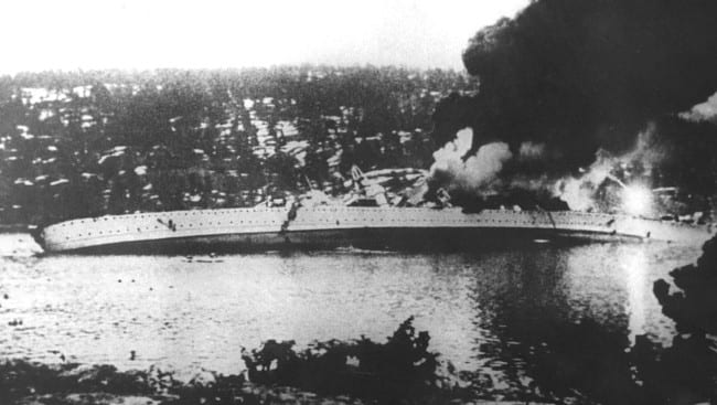 WW2: The German cruiser Blucher listing heavily to port after being hit by cannon fire and torpedoes from the Norwegian coastal fortress Oscarsborg. She sank a short time later.