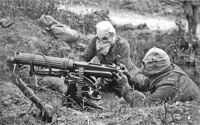 British troops wearing gas masks using the Vickers machine gun, one of the earliest examples of an automatic weapon at the battle of the Somme.