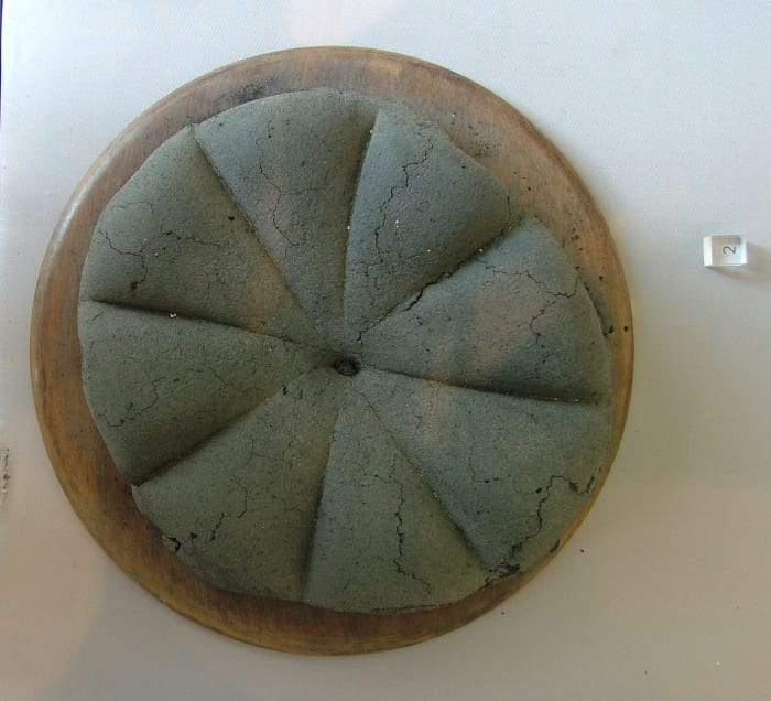 A preserved loaf of bread recovered from the archaeological site of Pompeii.