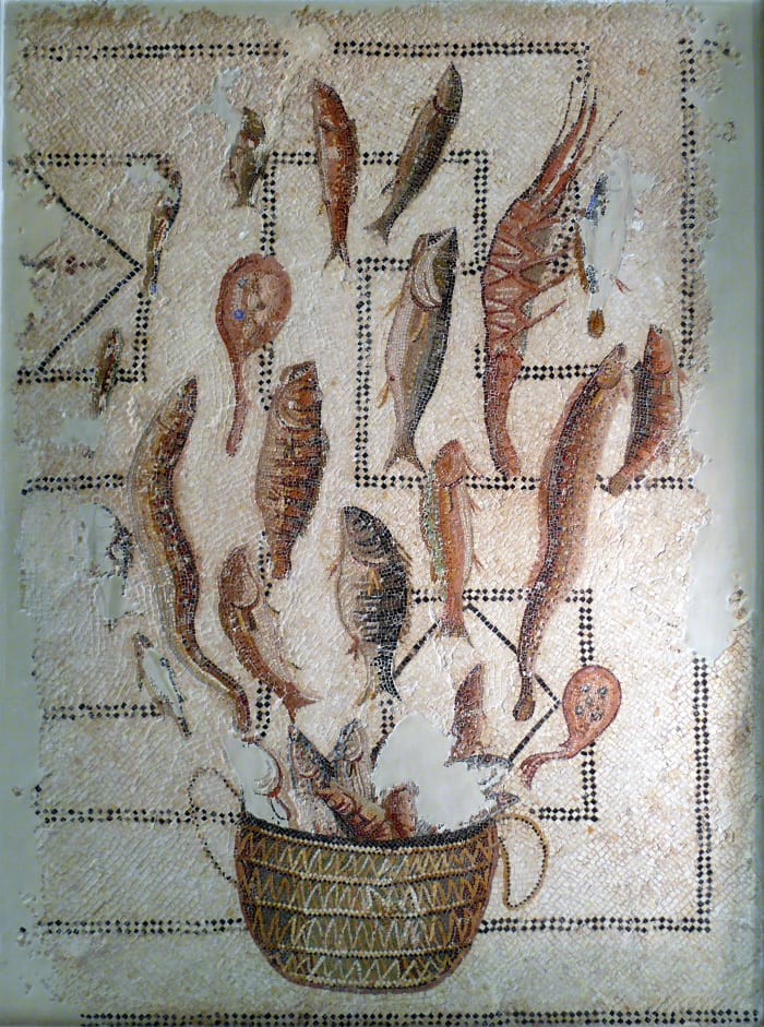 A Roman mosaic of various types of seafood in a basket.