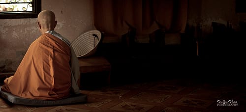A Buddhist monk meditates in an empty room. Not a very stimulating environment. But he doesn't get bored.