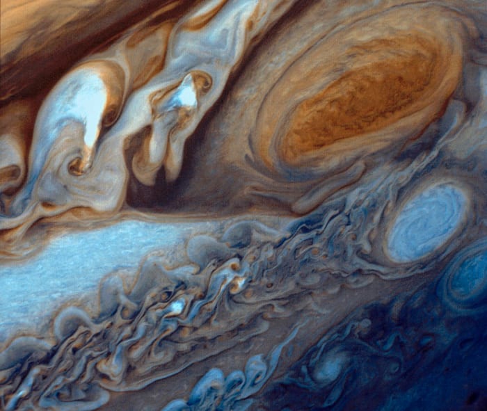 Early in 1979, NASA's Voyager 1 spacecraft zoomed toward Jupiter, capturing hundreds of images during its approach, including this close-up of swirling clouds around Jupiter's Great Red Spot.
