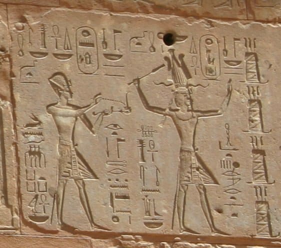 Hieroglyphs showing Thutmose III on the left and Hatshepsut on the right, she having the trappings of the greater role — Red Chapel, Karnak.