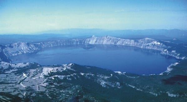 Crater Lake is also a small volcanic island within a much more ancient volcanic caldera that is no longer active