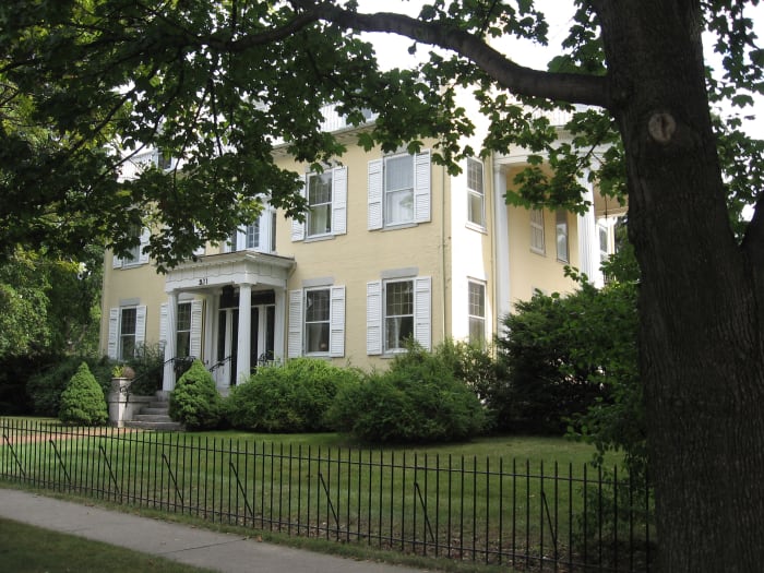 Home on corner of Ft. Hill and N. Main St. in Canandaigua, New York in whose front window a candle still glows in memory of the, now nameless, young man who left the home to fight in World War I and never returned