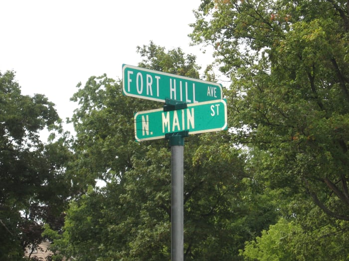 Corner of Ft. Hill and Main St. in Canandaigua, New York where a stately home still has a candle burning in memory of the son who went off to fight in World War I