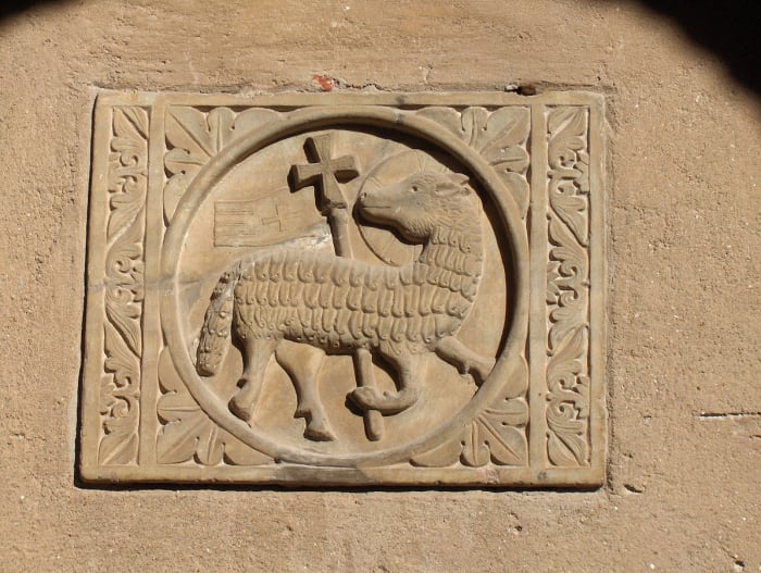 "Lamb of God (Agnus Dei)" with halo and cross on the wall of the atrium of the St. Euphrasius basilica, Poreč, Croatia.