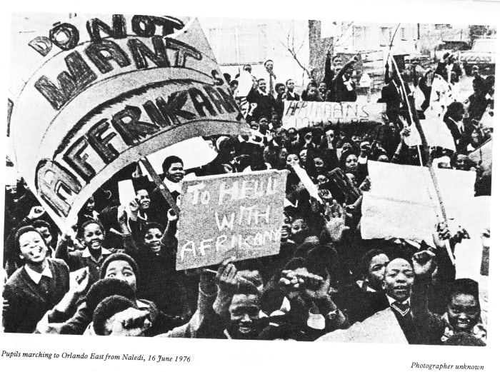 Students carrying placards before the police went on a shooting rampage souring the jovial and happy mood of students demonstrating
