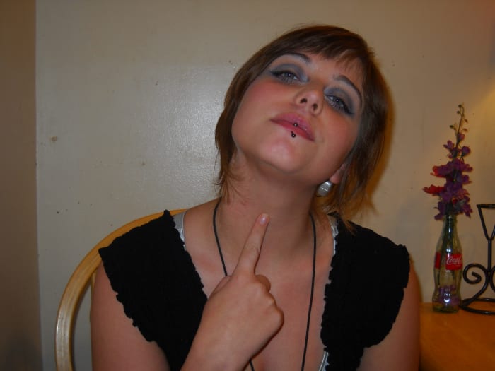 "Thirsty": Take your index finger and draw a line from the bottom of your chin to the base of your throat.