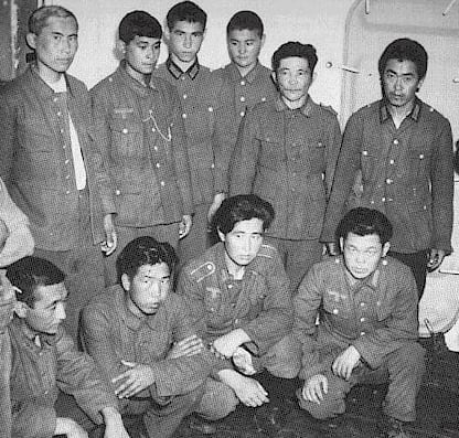 Korean soldiers dressed in German army uniforms. They were pressed into service by the Japanese, then the Soviets, then Germany, before being captured by Americans in France.