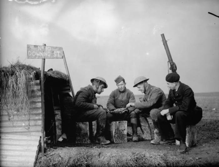 WW2 Sitzkrieg: English Army and French Air Force personnel on the edge of an airfield, 28 November 1939.