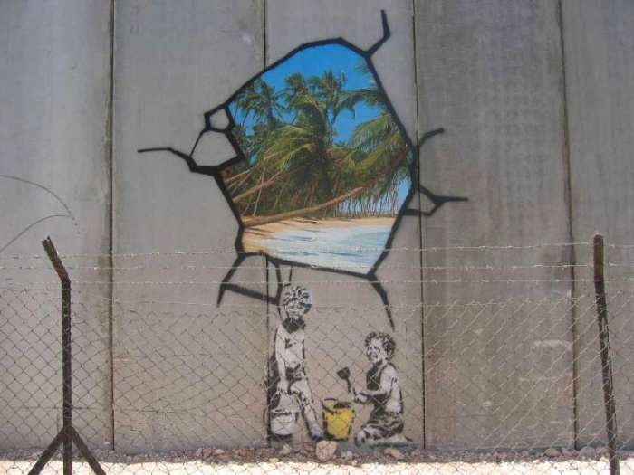 Image of hole in the wall, Israeli defensive barrier near Bethlehem Near 2005. Banksy's themes generally express ideas associated with left wing and anarchist beliefs, satirizing capitalism and established orders.