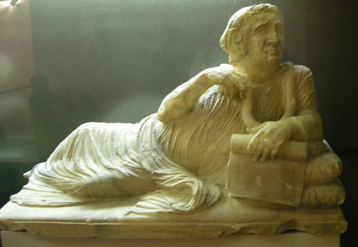 The frightened face of the man on this sarcophagus as he clings to his last worldly possessions marks the beginning of the Etruscans end.