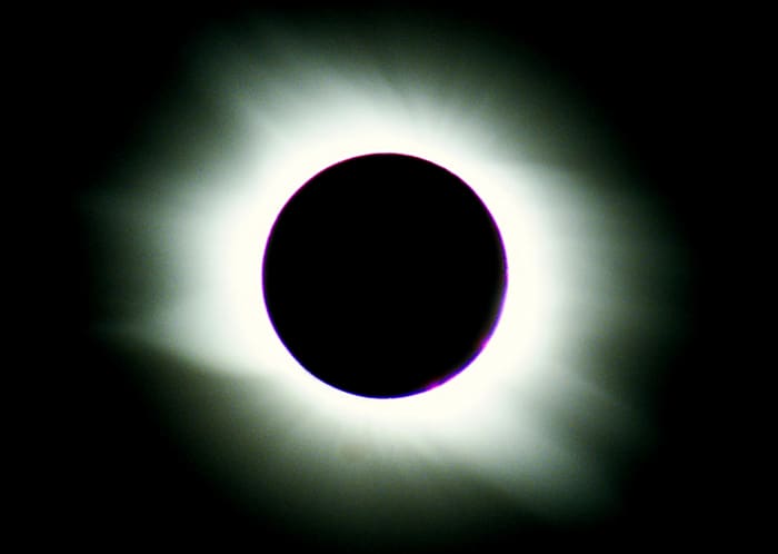 My own photo of a total eclipse of the Sun, taken in the Libyan desert in 2006. The flaring white light visible beyond the unlit Moon is the Sun's corona - only visible to us during a total eclipse