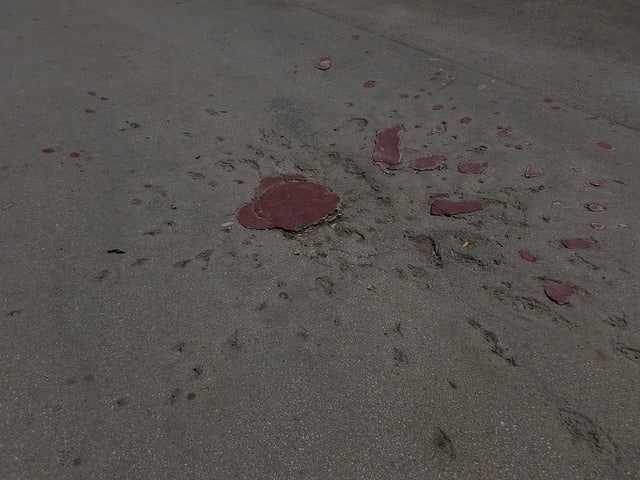 A Sarajevo Rose (mortar shell marks filled with red resin) mark where fellow citizens had fallen. Sarajevo Roses are found all over the city.