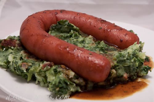 Boerekool (Farmer's Kale) - Mashed potatoe, cooked kale and smoked sausage with jus (gravy) and mustard. distorsiones.com
