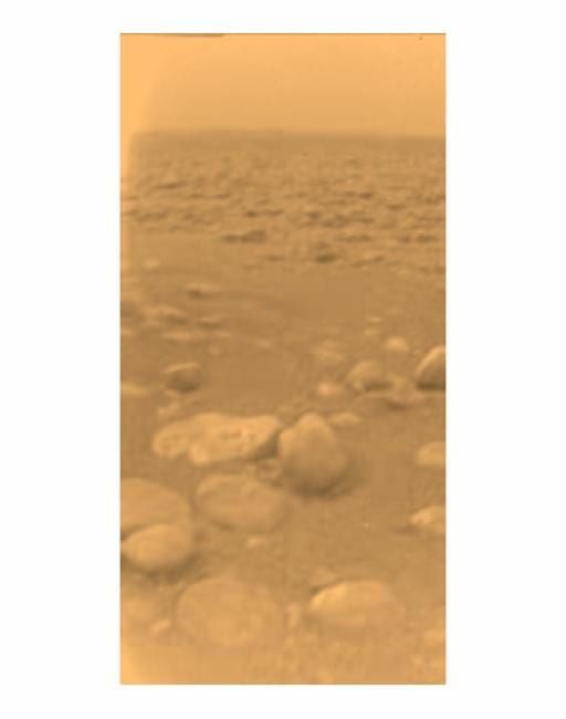 It doesn't look like much, but this photo from the surface of Titan is our first landing on a world beyond Mars -- 887 million miles from the Sun. A smoggy methane haze dominates. Pebbles are actually water ice, the "rock" on Titan.