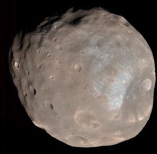 About 17 miles long, Phobos appears to be a captured asteroid circling Mars. In fact, it's caught in a death spiral: if Mars' gravity doesn't tear it apart into a ring, it will crash into the surface in ten million years.