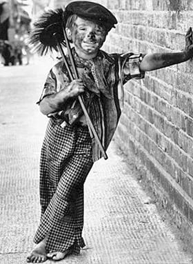 The jaunty look of this boy indicates that he was probably one of the luckier apprentices. However, he's still barefoot and in rags.