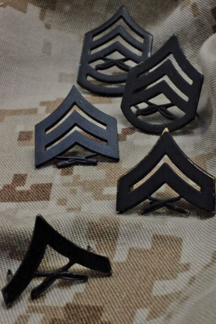 Officers and Enlisted Marines have many differences between their uniform details to distinguish their roles and history.
