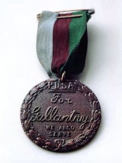 The United Kingdom's PDSA Dickin Medal (obverse) which is awarded to animals for conspicuous gallantry or devotion to duty while serving in a military conflict. "PDSA For Gallantry We Also Serve"