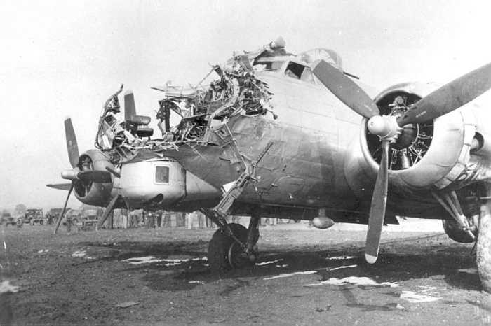 WWII: B-17 with severe nose damage incurred during a bombing mission. Flying Fortresses could take a lot of punishment and remain in the air.