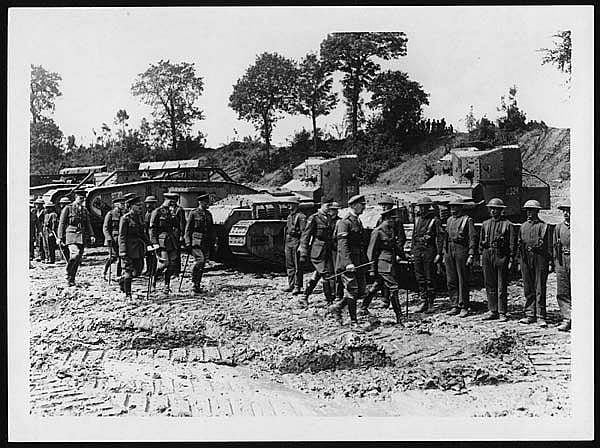 WW1: King George V visiting tank crews at the front. The two tanks on the right are Whippet (light) tanks. The others are heavy Mark V tanks.