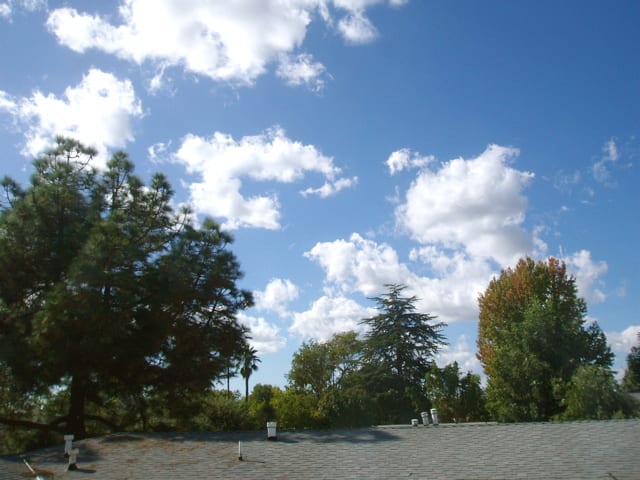 Water in its gaseous form––light clouds just coalescing from water vapor, but not nearly ready to rain.