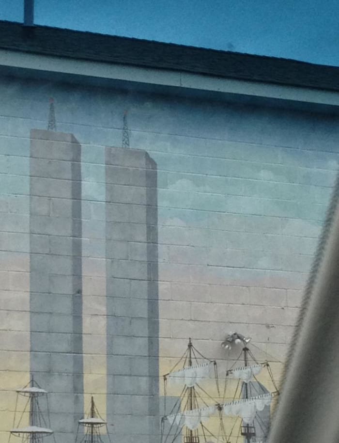 The Twin Towers painted on a building remind us that New York as been through other difficult times.