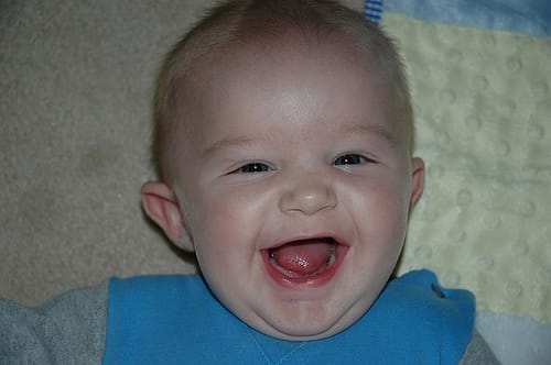 A baby laughs and we laugh, too.