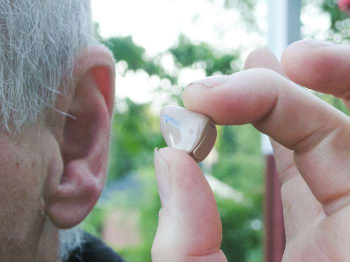 A hearing aid can prevent earwax from leaving the ear and cause it to collect inside the ear canal or the hearing aid.