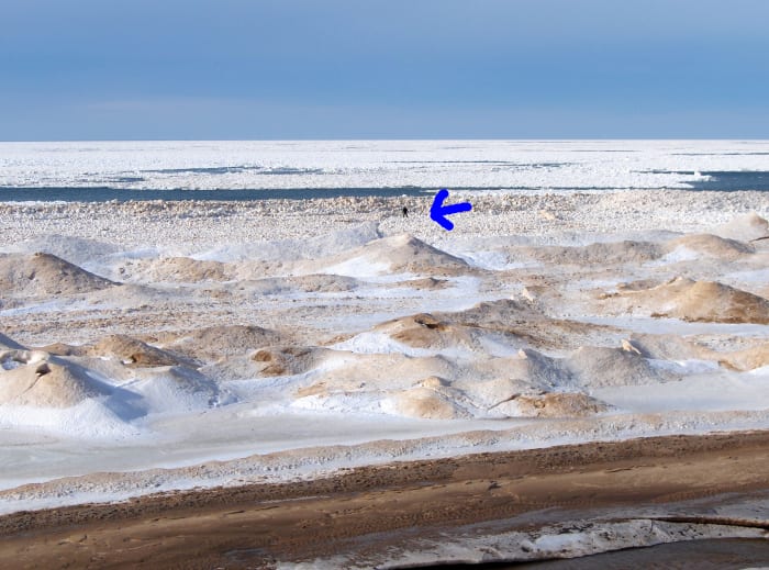 People taking risks at Pier Cove Beach, Southwest Michigan during a warm-up one week after the Polar Vortex event of 2014